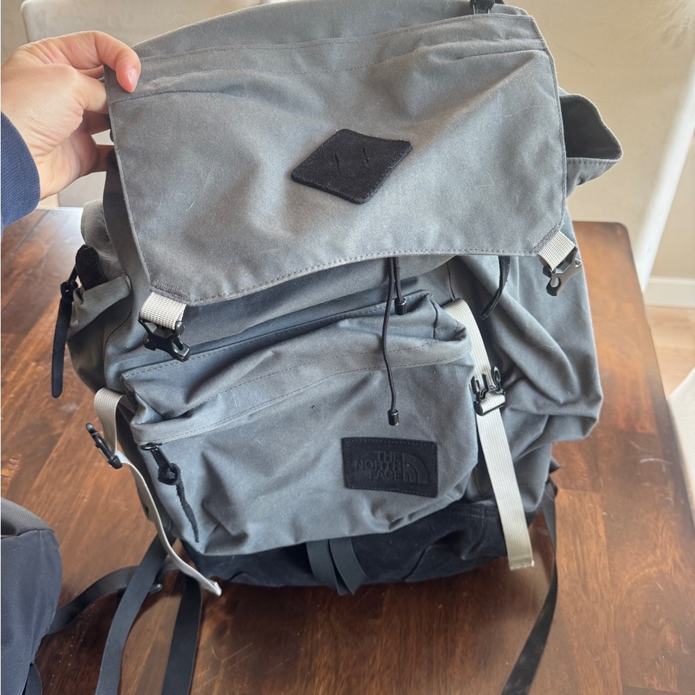 The North Face black and gray Rucksack Backpack with Adjustable Straps.